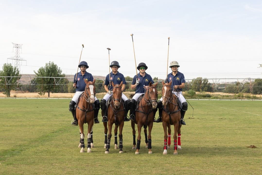 The Blue team of the Friendship Cup mounted on the grass field