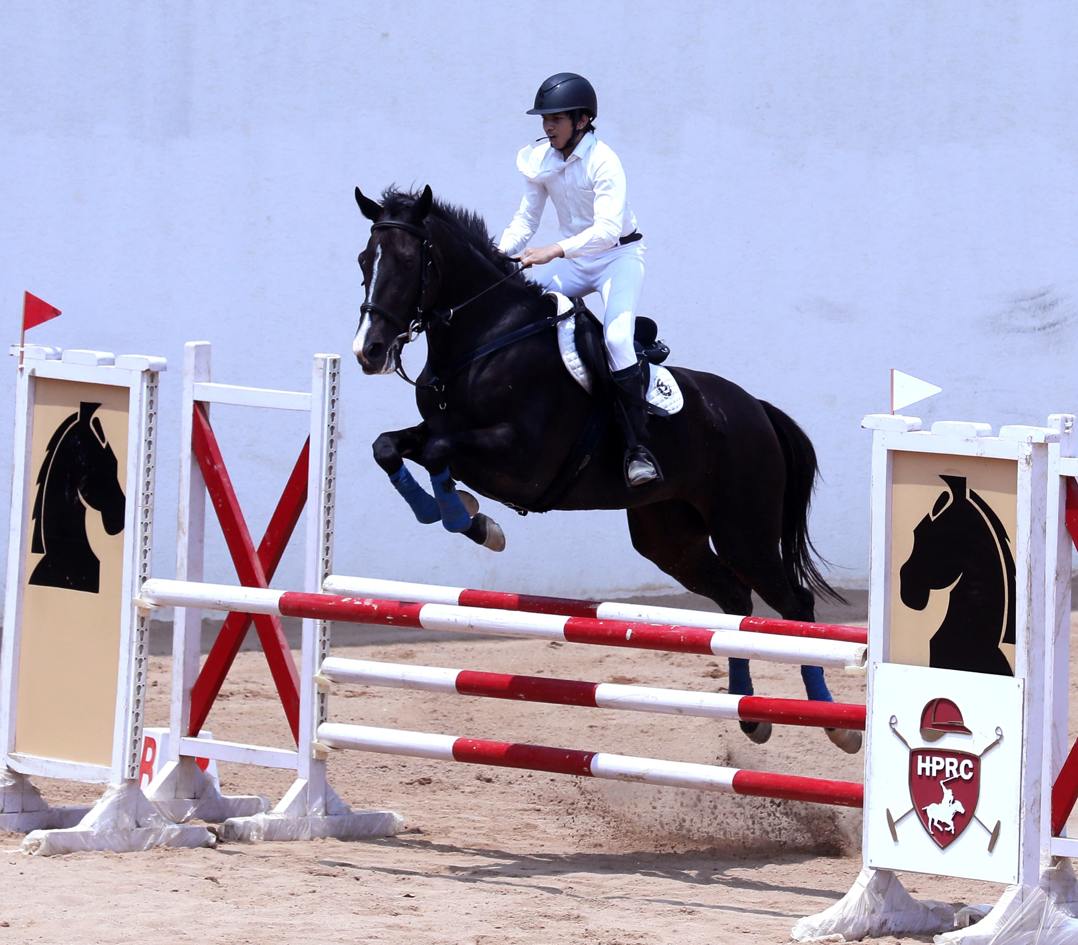 Faizan Khan jumping at HPRC Equestrian Challenge 2026